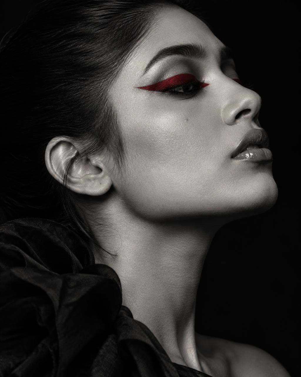 Graphic eye makeup in monochrome and red